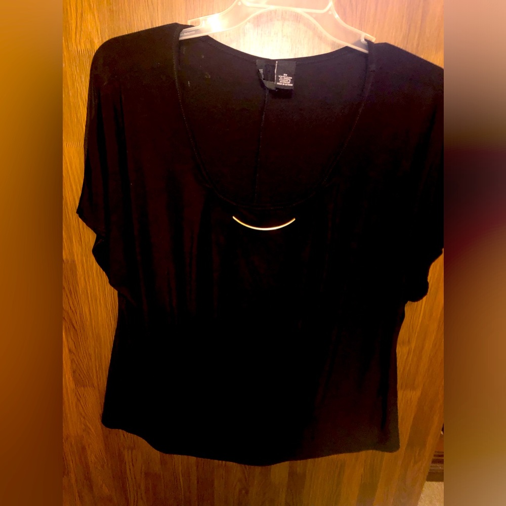Black blouse with a gold chain